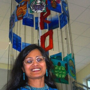 Shakun is an Indian female wearing a blue shirt.