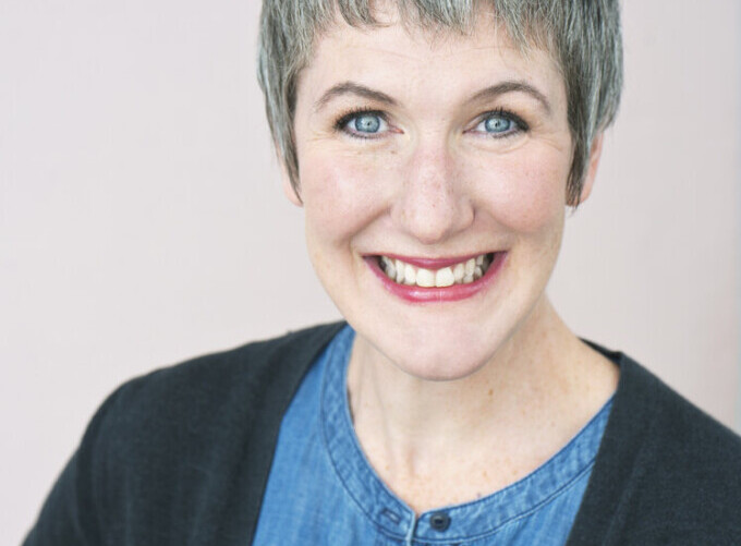 Jen is a white woman with a bright smile.
