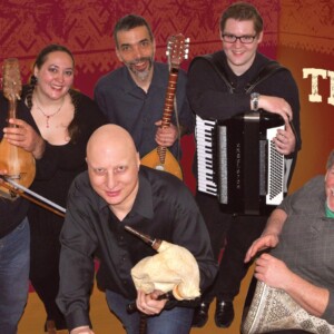 Traki is a group of six males and females wearing dark shirts.