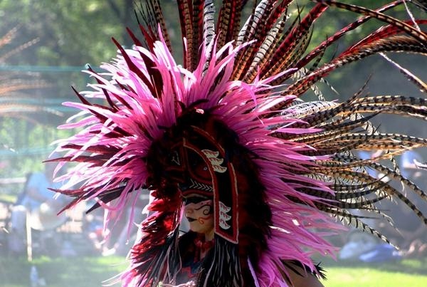 Susana is a Meso-American wearing a cultural outfit.