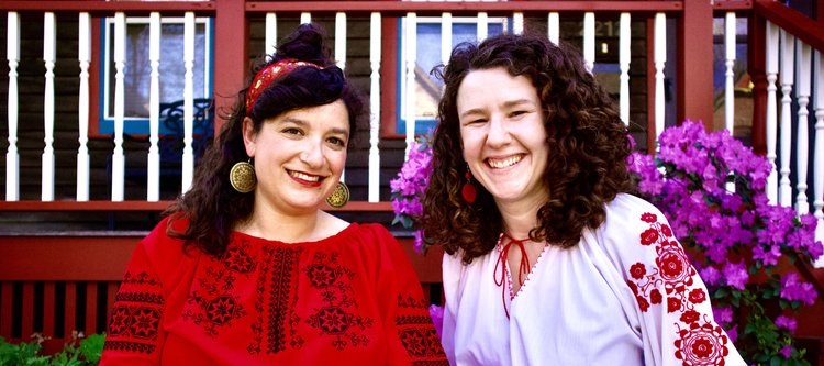 Nanilo are two white females wearing red and white shirts.