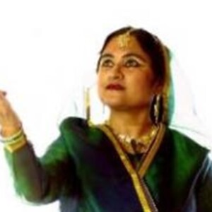 Rita of South Asian descent wearing a beautiful intricate traditional dance costume.
