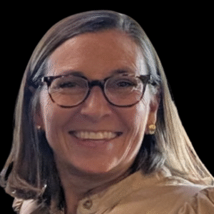 Smiling Amy Lucas in front of a black background.